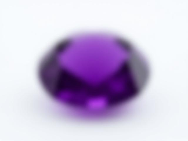A deep purple faceted amethyst gemstone, radiating a sense of calm.