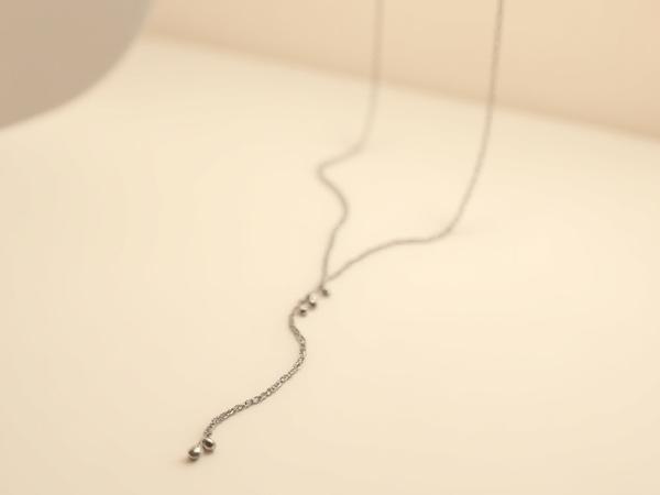 Sterling silver lariat style necklace with delicate drops